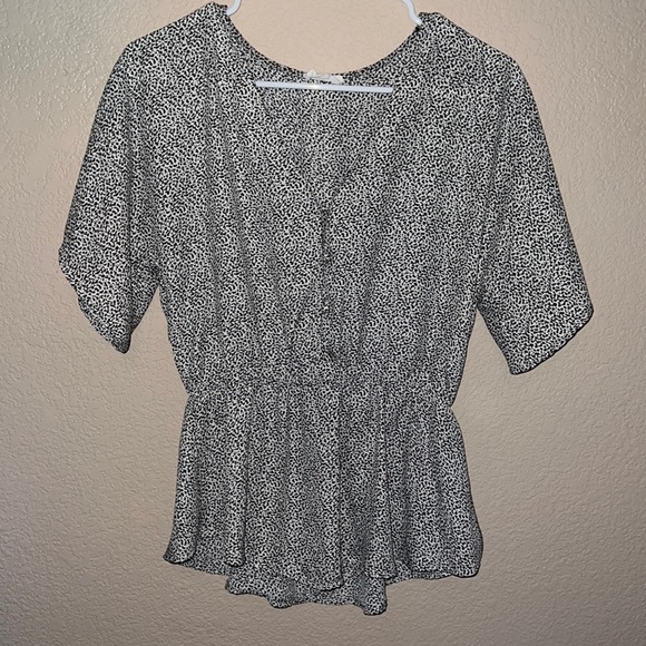 Black and white spotted, peplum top. - Picture 1 of 4
